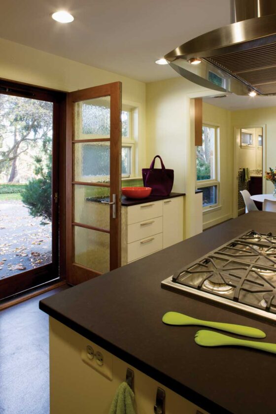 A kitchen door installed during the renovation offers a new, informal entrance and brings in more natural light.